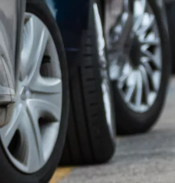 Cropped image of a car, focusing on the wheels